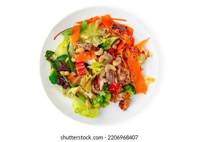 Salad Of Vegetables And Nuts. Balanced, Nutritious, Tasty And Nutritious Food. Ready-made Menu For A Restaurant Or For Delivery. Dish In A White Plate Isolated On A White Background.