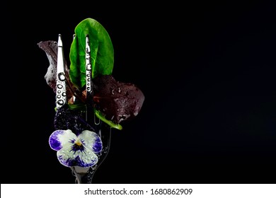 Salad With Violet Flower On A Fork