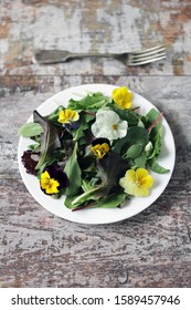 Salad with violets. Vegan Salad. Selective focus. Macro. - Shutterstock ID 1589457946