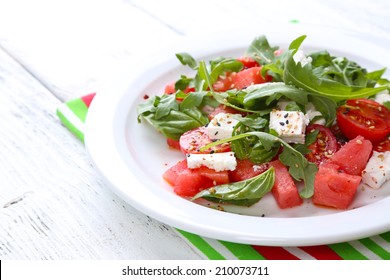 Salad With Watermelon,tomatoes,  Feta, Arugula And Basil Leaves On Plate, On Wooden Background