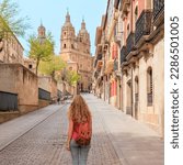Salamanca tourism in Spain with tourist walking in street