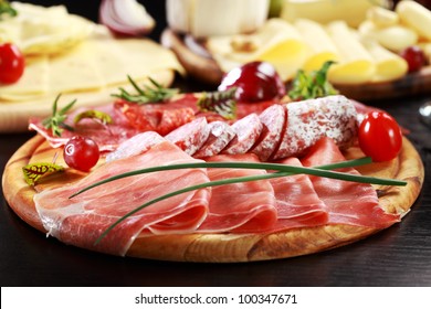 Salami and cheese platter with vegetable and herbs - Powered by Shutterstock