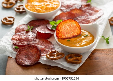 Salami chips baked in the oven with pimento and cheese sauce