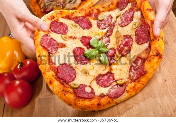 Salami Green Olives Pizza Held Hands Stock Photo Edit Now