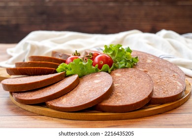 Salami Plate On Wood Floor. Close Up