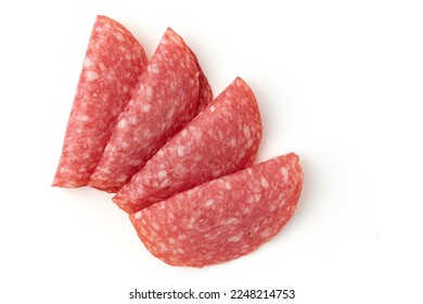 salami sausage slices isolated on white background, pieces of sliced salami sausage laid out to create layout