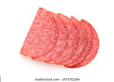 Salami slices on white background.