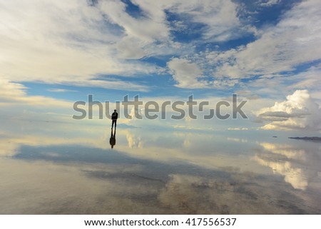 Similar – Hallig Gröde | Senior citizen stands in the calm North Sea at low tide and raises her hands to the sky