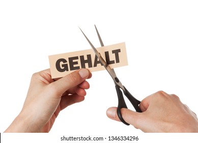 Salary Cut Concept. Hands With Scissors Cutting Through The German Word „Gehalt“ Which Translates To „salary“