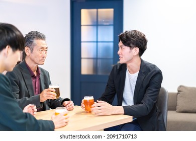 Salaryman drinking beer at beer bar - Shutterstock ID 2091710713
