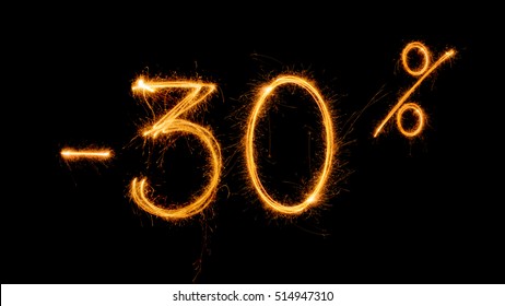 Sale 30 % off  - made with sparklers on black background. - Powered by Shutterstock