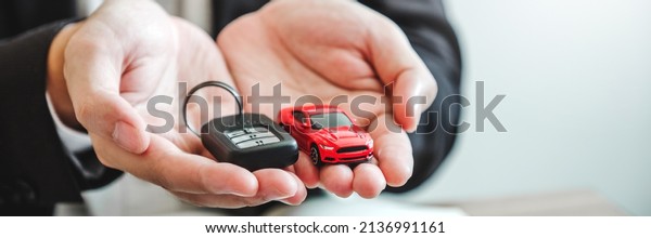 Sale\
agent deal to agreement successful car loan contract with customer\
and sign agreement contract Insurance car\
concept.