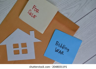 For Sale And Bidding War Write On Sticky Notes Isolated On Wooden Table.