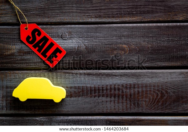 Sale for cars in shop with lable and figure\
on wooden background top view\
mockup