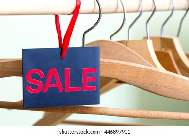 Sale Of Clothing Concept With Empty  Hangers