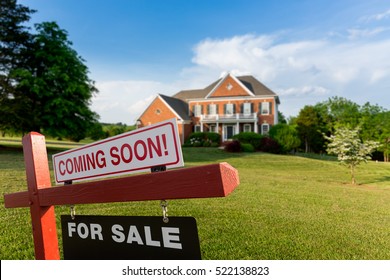 For Sale And Coming Soon Realtor Sign In Front Of Large Brick Single Family House In Expansive Grass Yard For Real Estate Opportunity