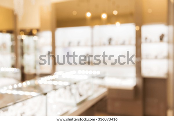 sale, consumerism, shopping and background\
concept - jewelry store blurred\
bokeh