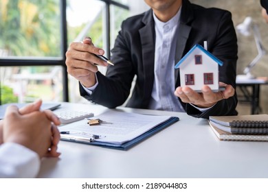 Sale Estate Agent Are Presenting Home Loan To Customer To Decision Signing Contract To Rental House Insurance With Approved Property Form