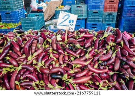 Sale of fresh abundant eggplant harvest at a local farmer's market in Turkey with price tag 2 Turkish Lira