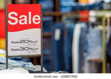 sale mock up advertise display frame setting over the stack of jeans and clothes line in the shopping department store for shopping, business fashion and advertisement concept - Shutterstock ID 1208817820