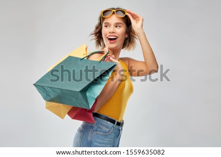 Similar – Yellow shopping bags on a blue background, Shopping concept