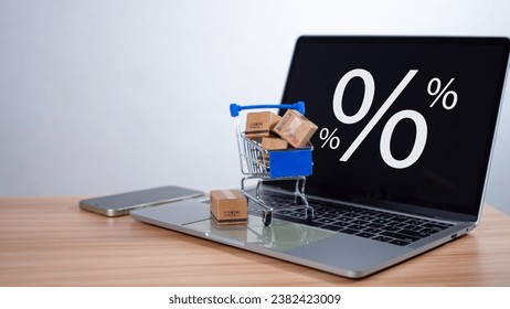 Sale percentage with shopping cart and boxes placed on computer keyboard. Online shopping concept, special price products, Special offers and promotions - Powered by Shutterstock