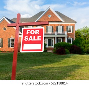 For Sale Realtor Sign In Front Of Large Brick Single Family House In Expansive Grass Yard For Real Estate Opportunity