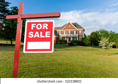 For Sale Realtor Sign In Front Of Large Brick Single Family House In Expansive Grass Yard For Real Estate Opportunity