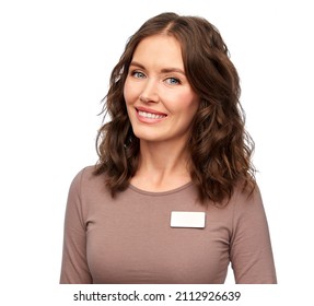 Sale, Shopping And Business Concept - Happy Female Shop Assistant With Name Tag Over White Background
