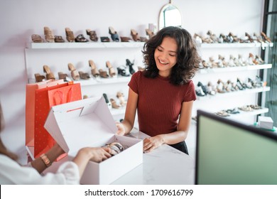 Sale, Shopping Concept - Young Asian Woman Or Shop Assistant With Shoe Boxes At Store