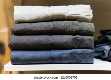 sale, shopping, fashion, clothes style concept - Stack of oxford shirt long sleeve ,Gray , Black and navy color, in the shopping mall.