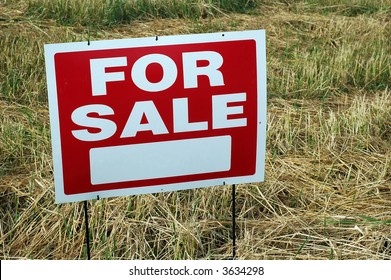 For Sale Sign In Empty Lot