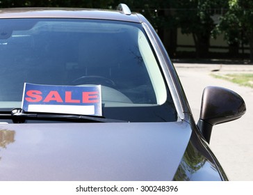 For Sale Sign On Windshield Of Car.