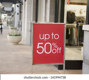 Sale Sign Outside Fashion Retail Store In Shopping Mall