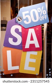Sale signs in shop window, big reductions - Shutterstock ID 2311257545