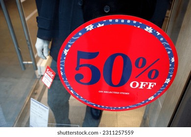Sale signs in shop window, big reductions - Shutterstock ID 2311257559