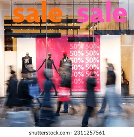 Sale signs in shop window, big reductions - Shutterstock ID 2311257561