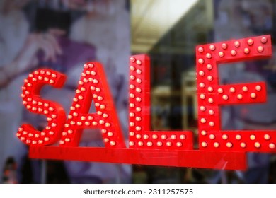 Sale signs in shop window, big reductions - Shutterstock ID 2311257575