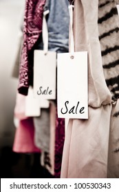 Sale Tag On A Rack Of Clothing In A Women's Boutique