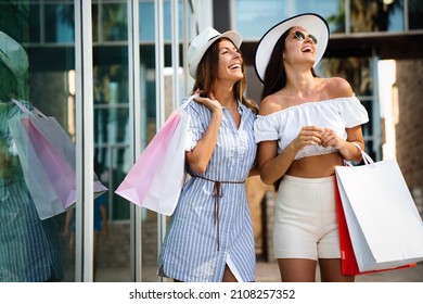 Sale and tourism, happy people concept. Beautiful women with shopping bag in the ctiy