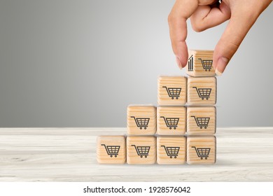 Sale Volume Increase To Make A Business Grow,  Wooden Cube With Shopping Cart Symbol.