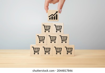 Sale Volume Increase Make Business Grow, Flips Cube With Icon Graph And Shopping Cart Symbol. Retail And Sales Growth Concept. Businesswoman Flips Cube With Icon Graph And Shopping Cart