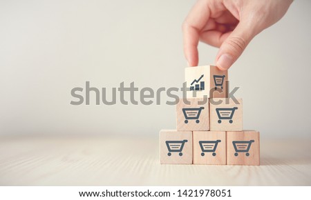 sale volume increase make business grow,  Flips cube with icon graph and shopping cart symbol.