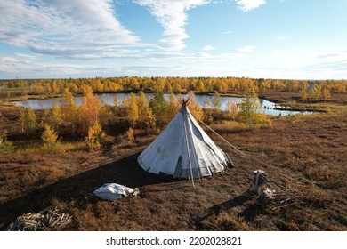 Salekhard, Yamalo-Nenets Autonomous Okrug (Yamal), Russia - September 2020: Nenets National settlement in the tundra near the lake. Plagues and personal belongings of tundra workers.
