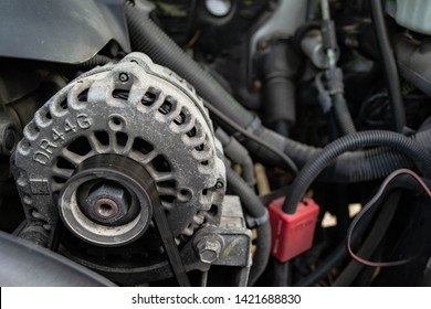 Salem, IL - June 3, 2019: A standard alternator found under the hood of a vehicle - Shutterstock ID 1421688830
