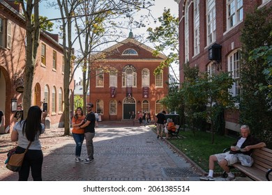 Salem, MA, US-October 14, 2021: Tourists pose for selfie photographs during the annual Haunted Happenings event held in October in celebration of the town's history of witch trials. SELECTIVE FOCUS