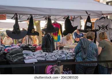 Salem, MA, US-October 14, 2021: Tourists shop for witches hats during the annual Haunted Happenings event held in October in celebration of the town's history of witch trials and of Halloween. 