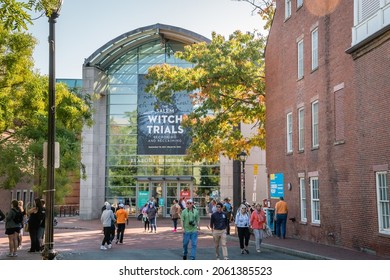 Salem, MA, US-October 14, 2021: People walk past the Peabody Essex Museum during the annual Haunted Happenings event held in October in celebration of the town's history of witch trials. 