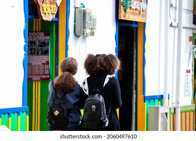 SALENTO, COLOMBIA - JULY 2021. Tourists Walking Along The Real Street Along The Real Street In The Beautiful Small Town Of Salento