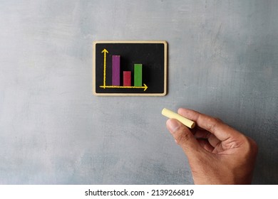Sales graph chart on chalkboard. Business and sales analysis report concept